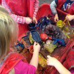 Image Shows children playing with paint at Woodstock Day Nursery